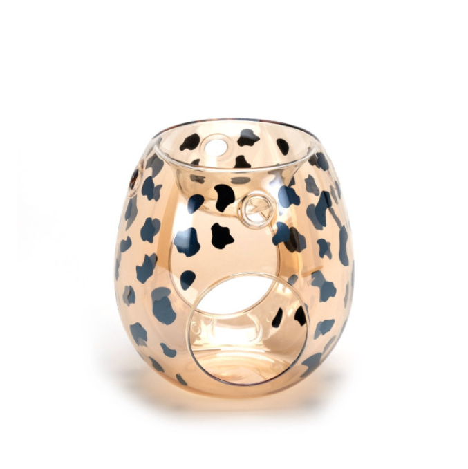 Amber glass wax melt burner with bold black cheetah print pattern.