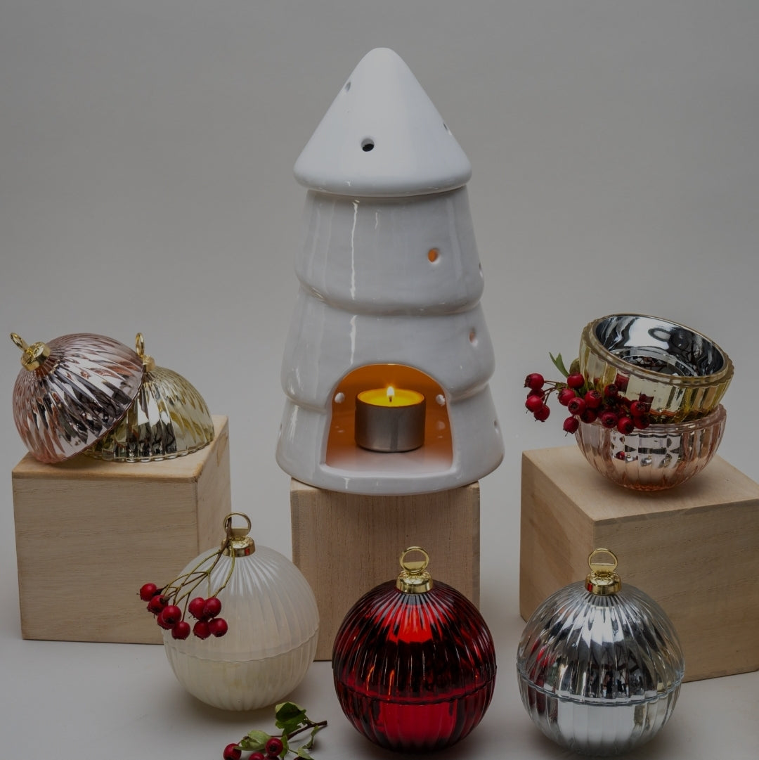 Add festive warmth with our white ceramic Christmas tree wax melt burner. Modern, refillable and perfect for cosy Christmas gifting.