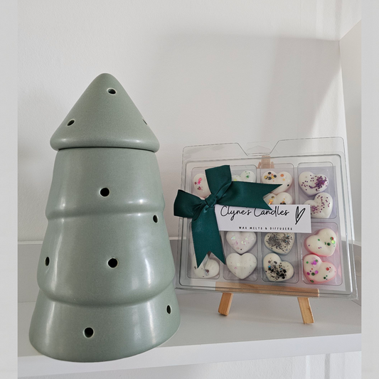 Matte sage green ceramic Christmas tree wax melt burner with cut-out detail by Clyne's Candles