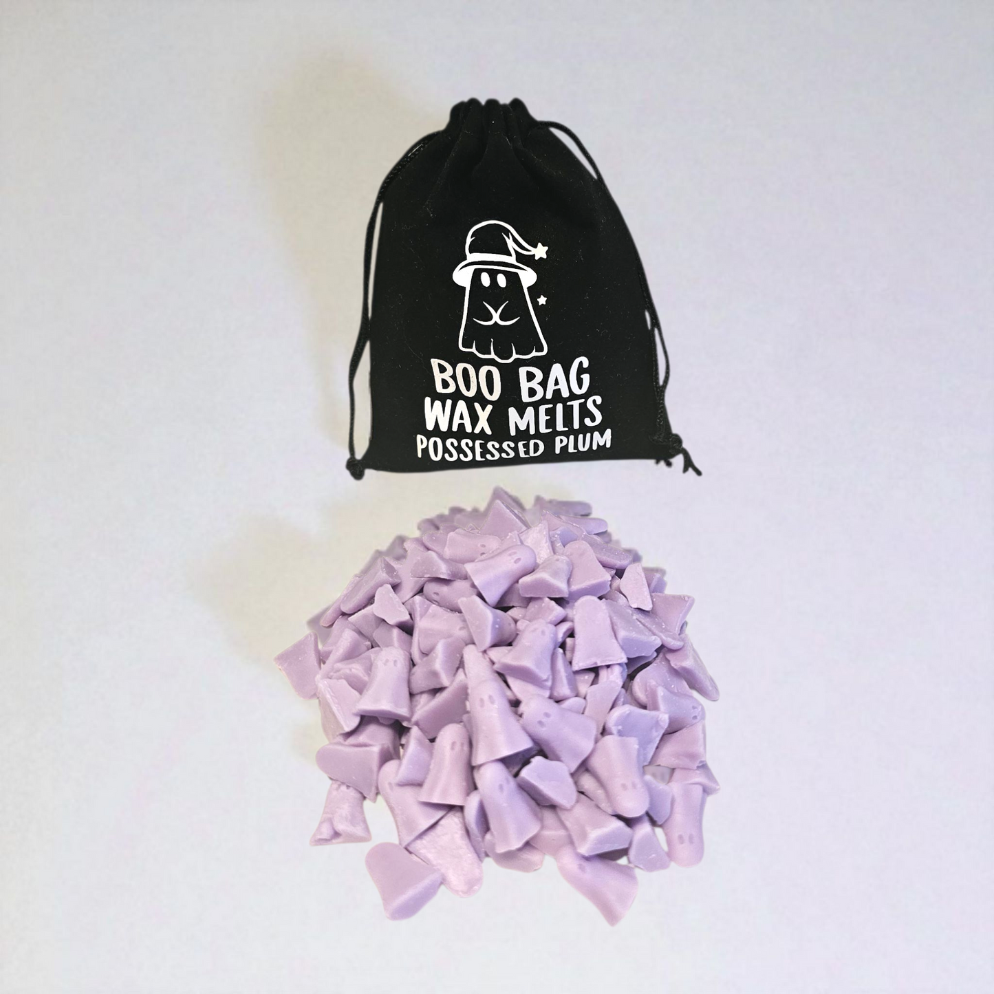 Velvet pouch filled with little scented long lasting wax melts, each with a unique design