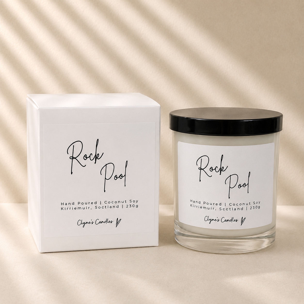 Rock pool scented coconut soy candle with a black lid and gift box, handmade by Clyne's Candles in Kirriemuir, Scotland