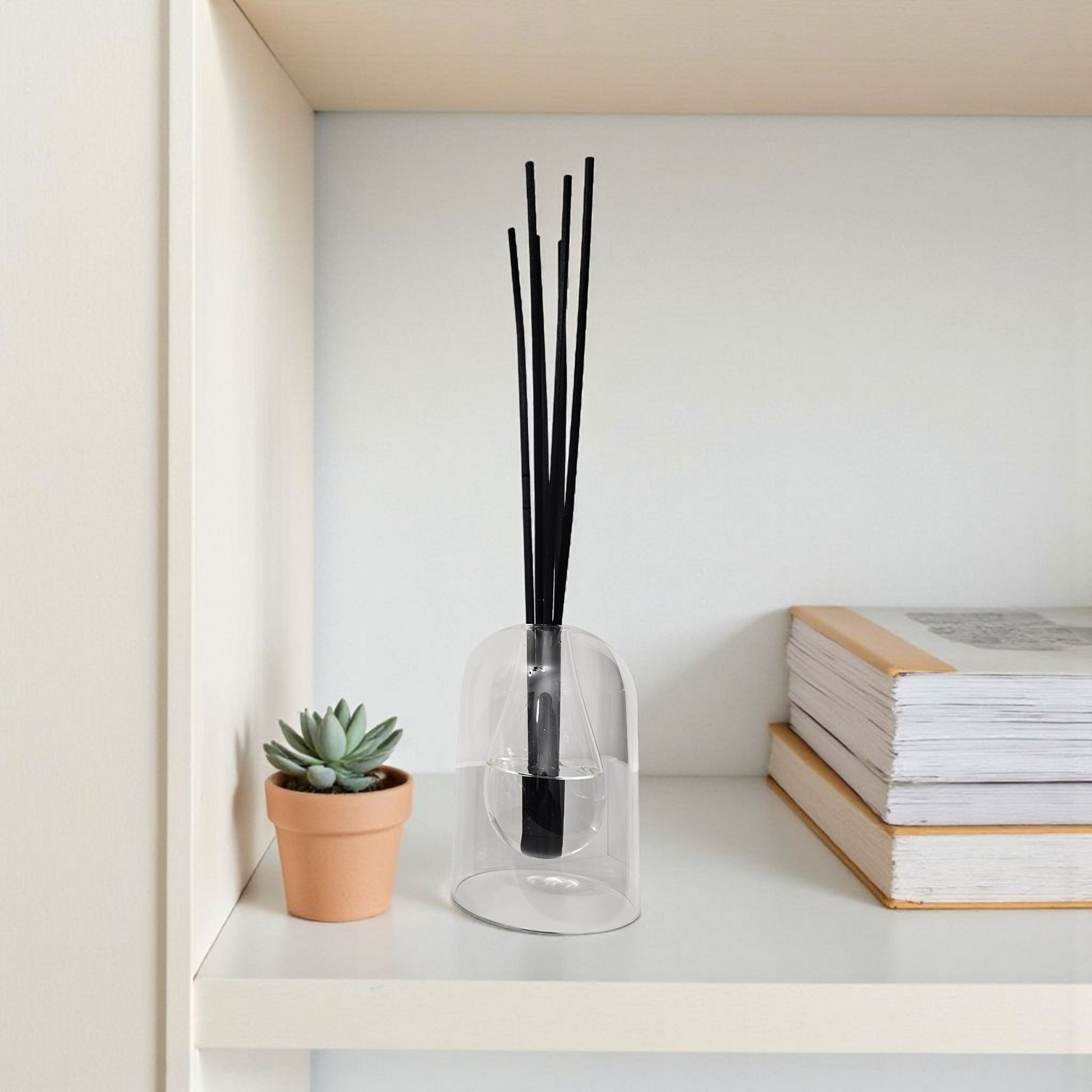 Luxury double-walled glass dome reed diffuser with teardrop centre, filled with scented oil and 40 cm fibre reeds, handmade in Kirriemuir by Clyne’s Candles.