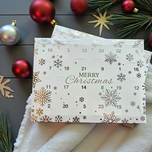 Wax melt advent calendar with 24 numbered doors, each containing a Christmas tree-shaped soy wax melt, handmade by Clyne’s Candles in Kirriemuir.