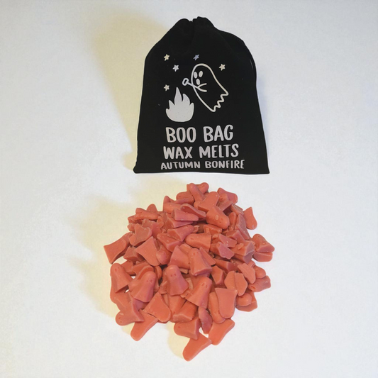 Velvet pouch filled with little scented long lasting wax melts, each with a unique design