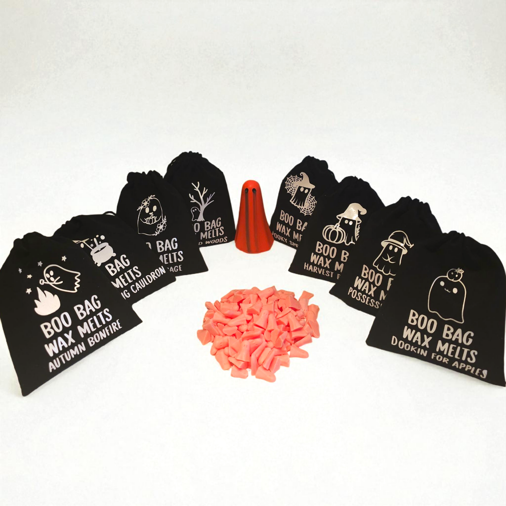 Velvet pouch filled with little scented long lasting wax melts, each with a unique design