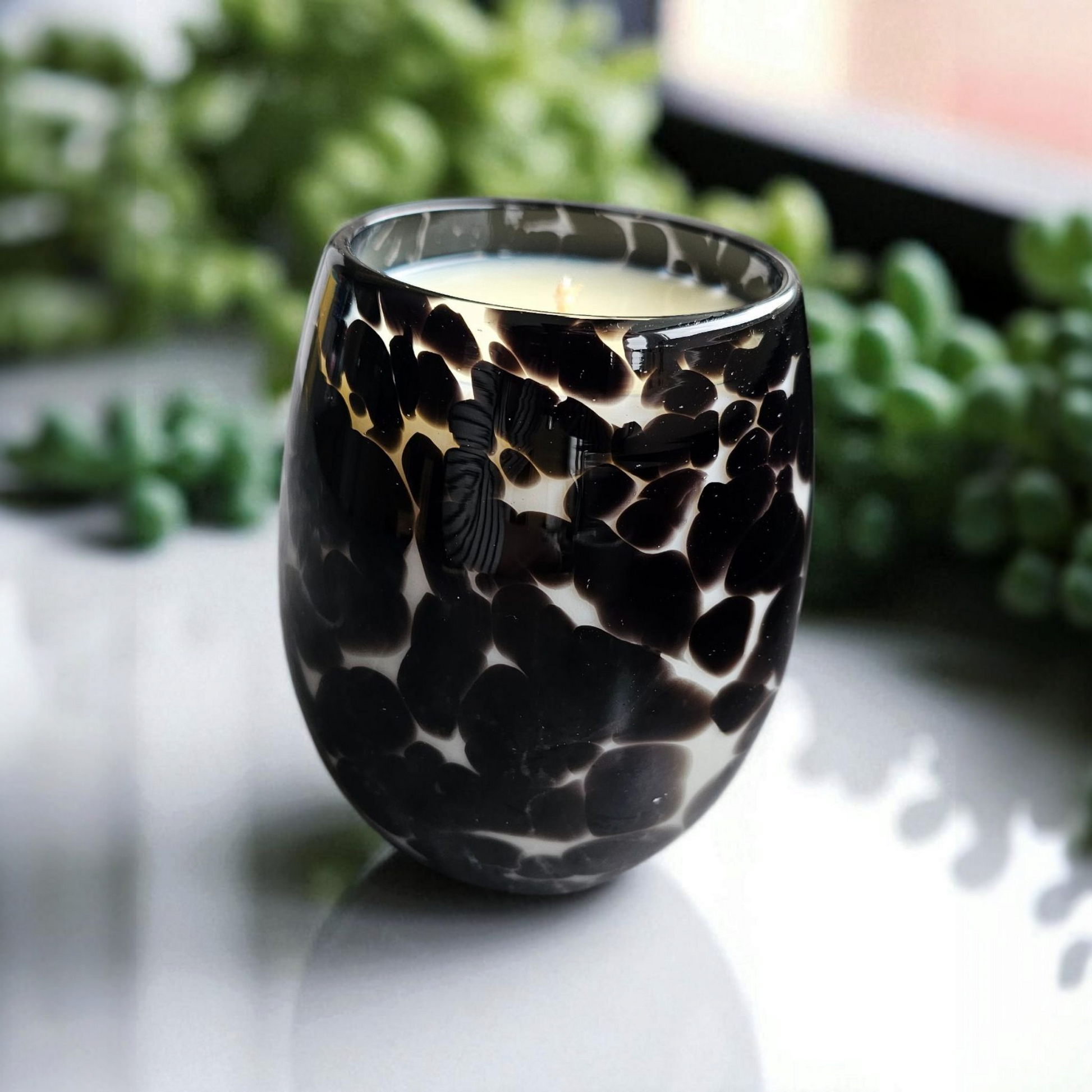 Beautiful hand poured coconut soy candle in a black cheetah print glass handmade by Clyne's Candles in Kirriemuir, Scotland