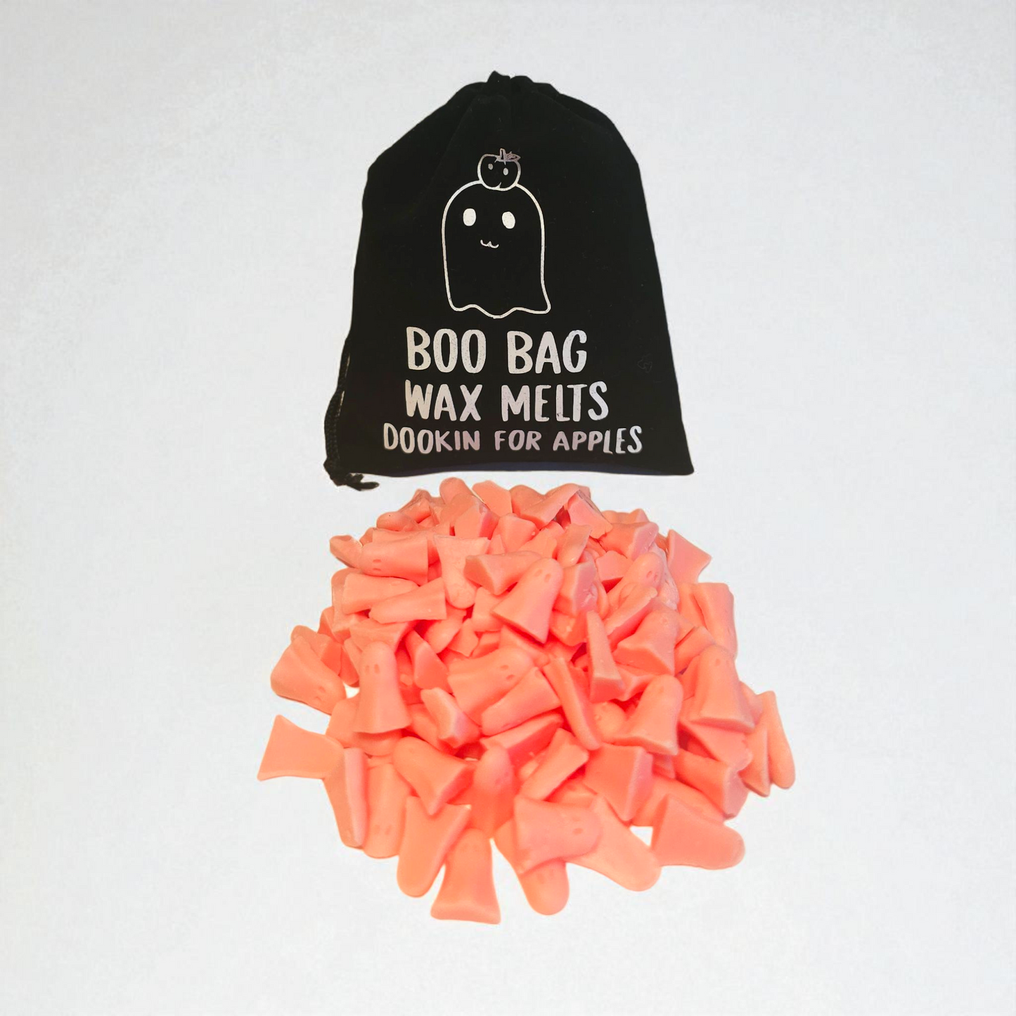 Velvet pouch filled with little scented long lasting wax melts, each with a unique design