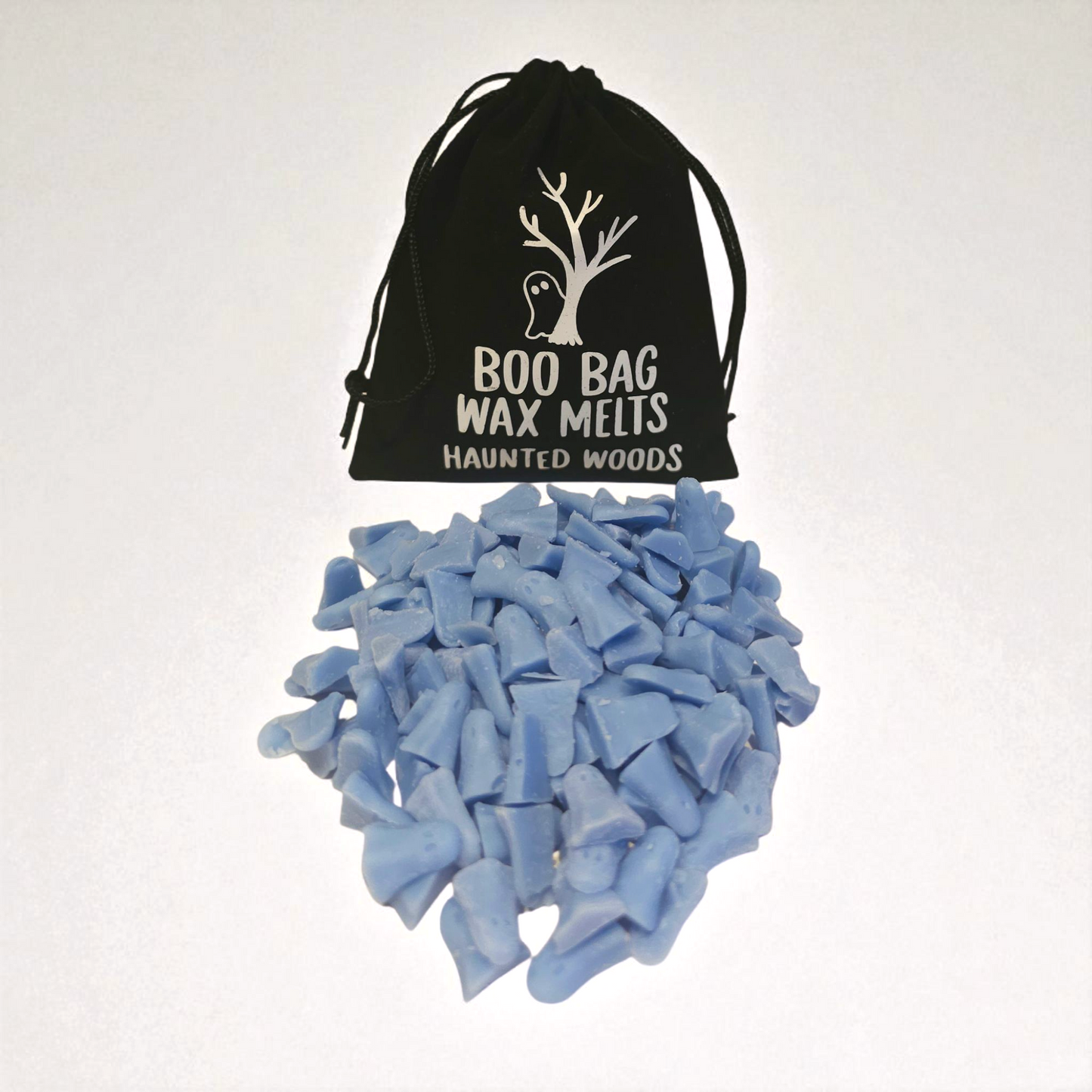 Velvet pouch filled with little scented long lasting wax melts, each with a unique design