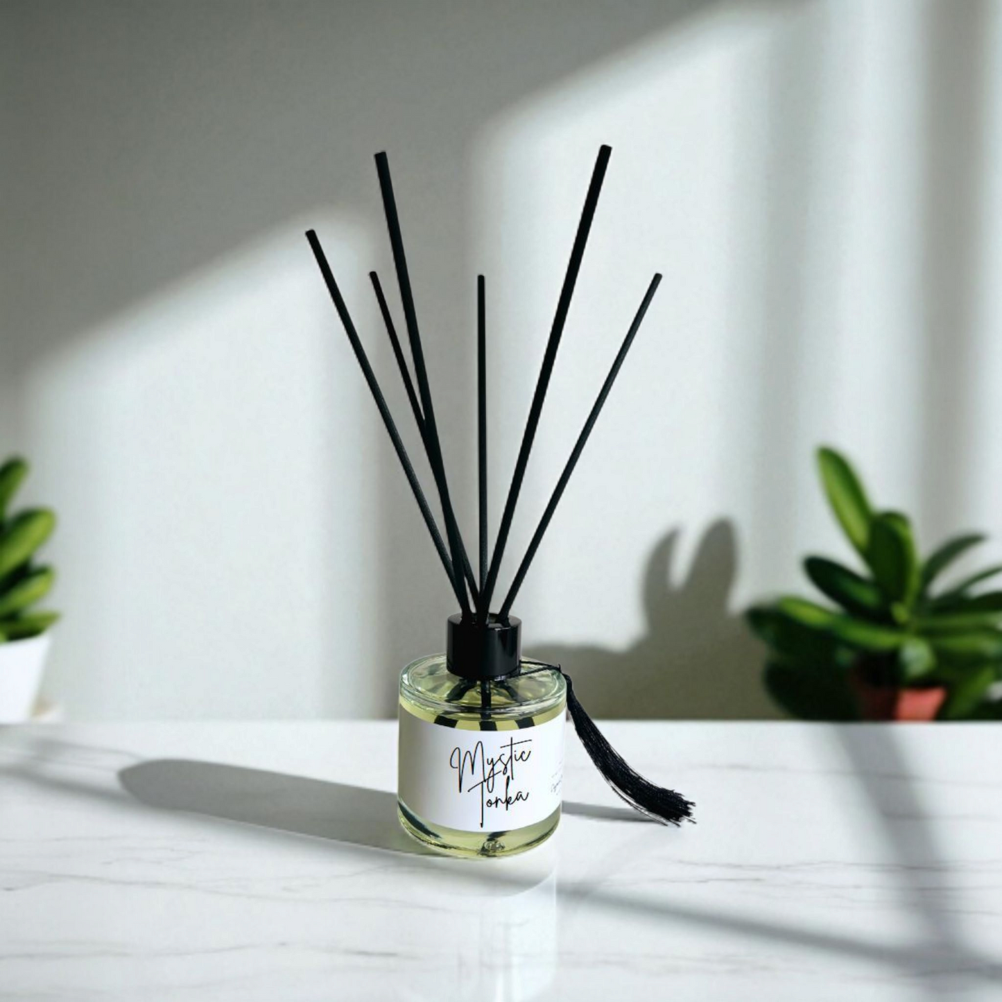 Designer Home-inspired reed diffuser with clear glass bottle and fibre reeds handmade by Clyne's Candles