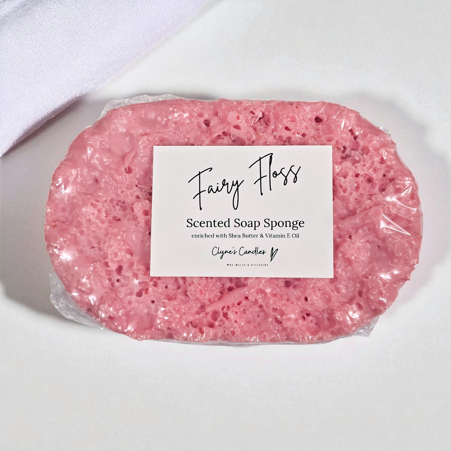 Snow Fairy Floss soap sponge by Clyne’s Candles, a dual-purpose exfoliating sponge infused with sweet candyfloss-scented soap for a fun, long-lasting bath or shower experience.