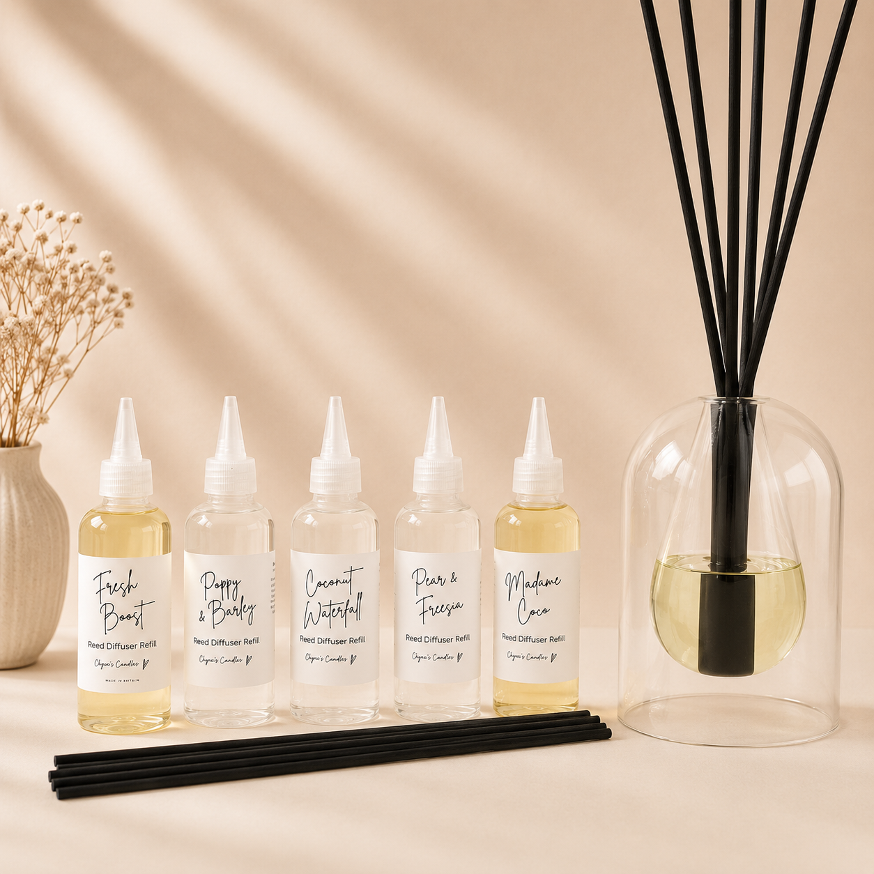 Luxury double-walled glass dome reed diffuser with teardrop centre, filled with scented oil and 40 cm fibre reeds, handmade by Clyne's Candles in Kirriemuir, Scotland