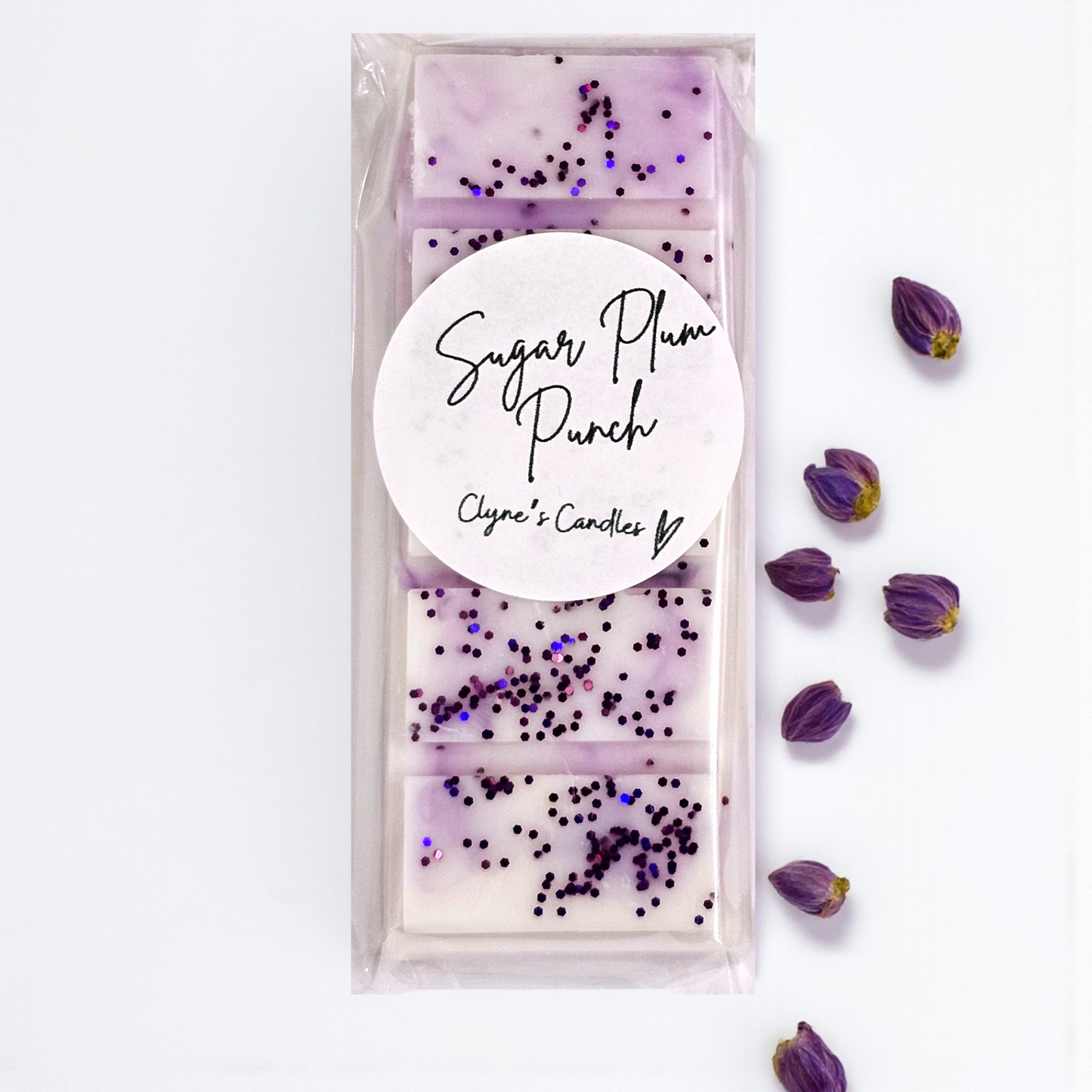 Sugar Plum Punch wax melt bar by Clyne’s Candles with raspberry, orange, cranberry and cinnamon notes.